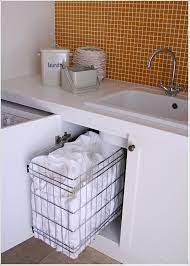 Pull out laundry hamper under sink. In The Fast Pace Of Life Where Every Minute Counts It Is Always A Good Idea To Work In An Organized Laundry Cabinets Laundry Storage Kitchen Storage Solutions