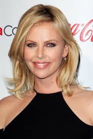 Theron has since grown out her short hair, seemingly effortlessly. Charlize Theron Red Carpet Hair And Hairstyles British Vogue British Vogue