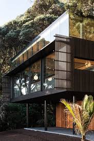 Dogs on edge of sea cliff. Contemporary Home On Stilts To Enjoy The Views Digsdigs
