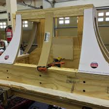 The entire top section of these range hoods serve as the removable panel and provides for easy access to ventilation and ductwork. Distinctive Arches Ceilings Katahdin Cedar Log Homes