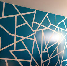The elements of various shapes create a unique mural mosaic paint. Geometric Wall Paint Design Color Glidden 10731 Ocean Teal Geometric Wall Paint Wall Paint Designs Wall Painting