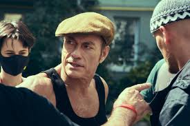 A mustache and yankees cap; The Last Mercenary 2021 Imdb