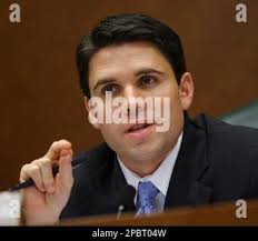 Rep. Patrick Rose, D, Dripping Springs, talks to journalists off the floor  of the Texas House of Representatives