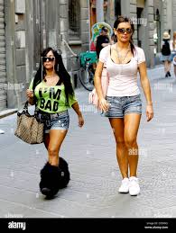 Nicole Snooki Polizzi and Jenni Jwoww Farley Jersey Shore girls visit  a tattoo parlour to book an appointment for Snooki. Although the temp was  a very hot 38 degrees, Snooki wore a