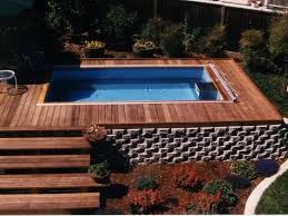 An Above Ground Endless Pool Surrounded By Container And Bed Gardens For More Backyard Installation Ideas An Endless Pool Backyard Pool Swimming Pool Designs