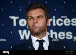 Dagenham manager Daryl McMahon (R) looks