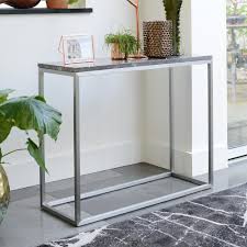 A table is a versatile piece of furniture, often multitasking as dining, working, studying, gaming, and living area. Cadre Marble Console Table Grey Dwell