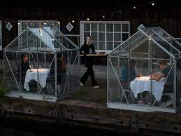 The classic glass walls and roofs create an enclosed space to keep plants safe and warm throughout the season. An Amsterdam Restaurant Built Small Greenhouses For Social Distancing