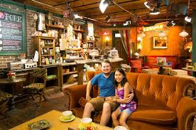 A stage for musical performances with a sofa; Manchester Is Getting A Central Perk As The Friends Cafe Comes To Primark