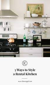 Sometimes they are even there to just fill the space above your cabinets. 5 Ways To Style An Ugly Renter S Kitchen The Everygirl