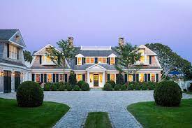 The tidewater house is typical and features wide porches, constructed of wood with the main living area raised one level. Preppy New England Architecture Gets A Modern Update New England Style Homes Preppy House Harbor House