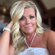 What is the brand or where to find Angela's cross necklace?