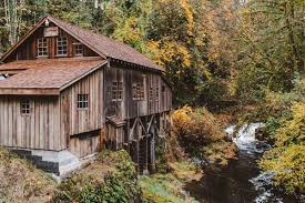 In the mid 1800's, a grist mill was built above the falls to utilize this water power for grinding grain. Cedar Creek Grist Mill Elopement Sean Carr Photography Portland Wedding Elopement Photographer