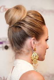An ornament (such as a knot of ribbons or a pompom) 2 : No Joke This Small Tweak Makes High Buns Infinitely More Wearable Hair Styles High Bun Hairstyles Pretty Hairstyles