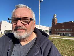 The final piles of dirt are being hauled away. Now it's just a snowy field.