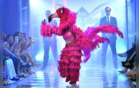 The studio audience votes on who wins the battles, with the losers then facing off and getting judged by ken jeong , jenny mccarthy, nicole scherzinger and robin thicke. Adrienne Bailon Revealed To Be The Pink Flamingo On The Masked Singer