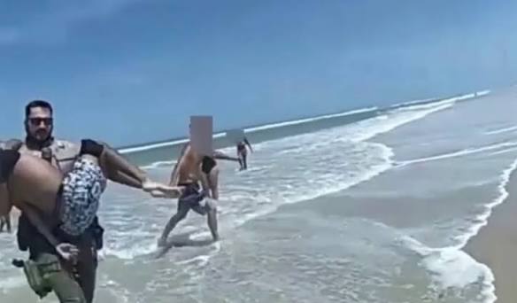 Recently released police bodycam footage captures the moment when two  officers with National Park Service law enforcement rescued two drowning  victims at Canaveral National Seashore in Florida. Learn more through the  link