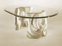 You can see the example image below. Table With Base In Stone And Top In Glass Idfdesign