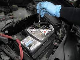 While firmly holding the new battery, gently lower it into position. Replacing A Car Battery With Side Clamp Fixing