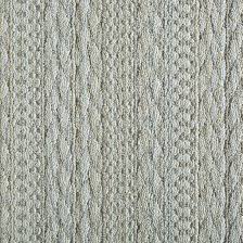 Its neutral tones and soft pebbled texture blend well in both modern and traditionally styled rooms alike. Cable Knit Motif Gray Rug