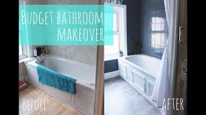 She kept the deep green tiles, but paired them with classic white fixtures, paint, and decor. Budget Bathroom Makeover Youtube