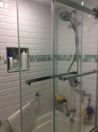 Hardware, lighting, switchplates, tile, home accents Shower In My New Bathroom Reno White Beveled Subway Tiles With Accent Tiles Of A Mix O Sliding Glass Doors Patio Glass Subway Tile Bathroom Barn Doors Sliding
