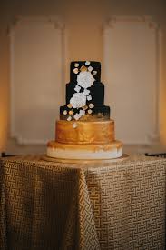 Maybe you would like to learn more about one of these? Modern Sophisticated Black White And Gold Five Tier Round Wedding Cake With Black To Gold Ombre And White And Gold Florals On Gold Cake Stand On Geometric Gold Linen Tampa Bay