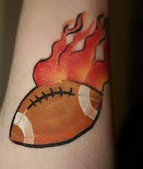 When the paint is applied to the whole body or to a large portion of the body then it is known as body painting. Flaming Football Tattoo Face Painting Face Painting Easy Football Face Paint