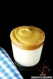 Pour milk into a glass; Dalgona Coffee Whipped Coffee Swasthi S Recipes