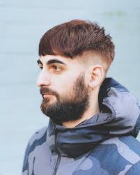 Modern taper fade with warm wood colour. #avedaartist #menshair  #fadehaircut #barber #shorthair #dexterthebarber #hairstyle #avedacolor