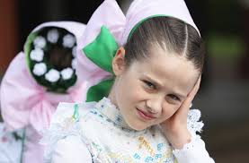 Corpus Christi: Catholics take part in religious processions in traditional  dress across the world