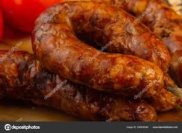 homemade sausage on a wooden background