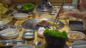 Order a series of small plates, including the namesake bao filled with pork belly, buffalo chicken, hot dogs or tempu. Bulgogi Korean Barbecue Self Cooking Stock Footage Video 100 Royalty Free 14628478 Shutterstock