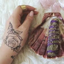 Kali Uchis 6 Tattoos Meanings Steal Her Style Hand Tattoos Back Of Hand Tattoos Tattoos