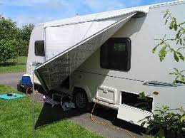 Putting Up A Roll Out Awning Step 2 Rv Accessories Rv Equipment Trailer Accessories