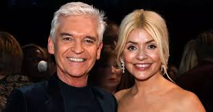 Phillip Schofield parties without pal Holly Willoughby as she sneaks out of  NTAs early