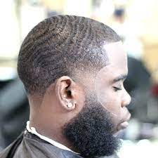 This taper fade black men haircut is styled with an afro on the top, creating a box shape. 2 Haircut Black Man Bpatello