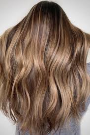 This color best accentuates complexions with olive tones. These Dark Blonde Color Ideas Are Low Maintenance Goals Dark Blonde Hair Color Blonde Hair With Roots Dark Roots Blonde Hair