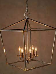 The Open Lantern Shaped Design Of This Architectural Pendant Is Highlighted By The Brushed Nick Iron Pendant Light Lantern Light Fixture Brass Lantern Pendant