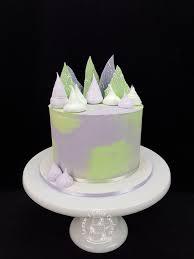 This Purple And Green Baby Shower Cake Went On Top Of A Cupcake Tower It Is A Red Velvet Cake Filled And Cover Caramel Mud Cake Chocolate Mud Cake Bottle Cake
