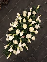 Maybe you would like to learn more about one of these? White Rose And Arum Calla Lily Coffin Spray Funeral Flowers Tribute Funeral Flowers Funeral Flower Arrangements Dad Funeral Flowers