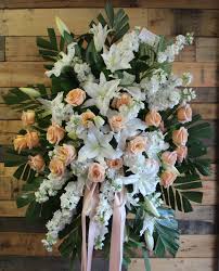 An example of a standing spray that can be sent by the extended family. Peach And White Standing Spray In Temple City Ca Fanny S Flowers