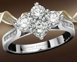 Engagement Ring Of The Day This Cluster Diamond Ring Set In Platinum Four Stone Ring Round Brilliant Diamond Ring Diamond Rings Design 25 Anniversary Rings