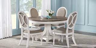 The most popular combination is one table and four chairs to create a 5 piece dining set. French Market White 5 Pc Round Dining Room Round Dining Room Rooms To Go Furniture Dining Room Sets