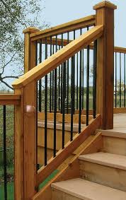 Transcend® railing in classic white with vintage lantern and black round balusters with decking in spiced rum and vintage lantern. Veranda Deck Stair Railing Kit Round Balusters Peak Products Canada