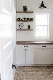 Even the fanciest farmhouse kitchen feels like it's made for pulling up a stool and kicking back with a mug of tea and a slab of apple pie. Brick Like Tile Farmhouse Style Kitchen Cabinets Farmhouse Style Kitchen Trendy Farmhouse Kitchen