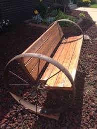 Stylish wheeled timber bench chinese fir from managed sources burntwood finish specifications height 75cmlength 105cmdepth 56cmweight 11kg. 8 Best Wagon Wheel Bench Ideas Wagon Wheel Bench Wagon Wheel Wagon