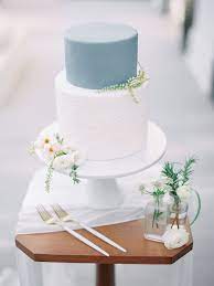 Minimalist White And Gray Aesthetic Wedding Cake With Silk Chiffon White Table Runner Wedding Cake Inspiration Milk Glass Cake Stand Cake Inspiration