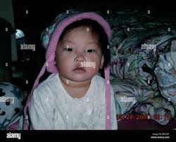 December 6, 2008 San Diego, CA KAYVIANA<cq> HOLLAND, 8, right, and her UCSD  Police Officer JOSEPH LEA'E<cq>, right, smile as they get started