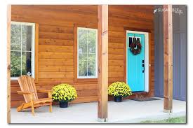 A turquoise front door is surrounded by sidelights and a large transom to let in the light. Dream Front Door Sugar Bee Crafts